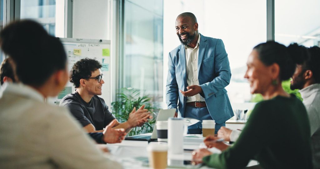 man presentation applause office meeting team success with support finance company person speaker paperwork with group motivation achievement with goal investment agency